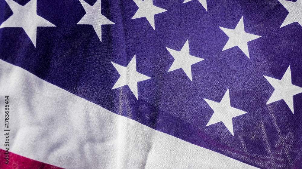 Fototapeta premium American flag with stars and stripes displayed close-up fabric texture