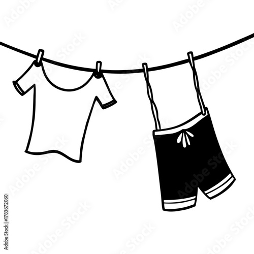 T shirt and shorts drying on a clothesline