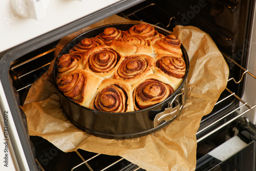 Closeup homemade cinnamon rolls from yeast dough baked in a home oven.
