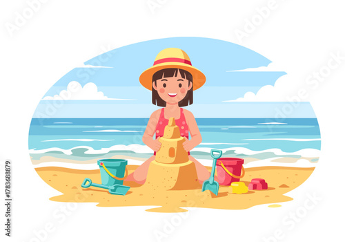 Joyful young girl happily building a sandcastle at the beach under a blue sky