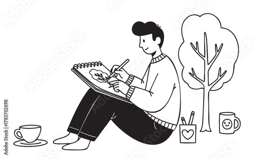 Black and white illustration of an asian male artist in a sweater drawing a leaf in a sketchbook while sitting near a tree with a cup and pencil holder.