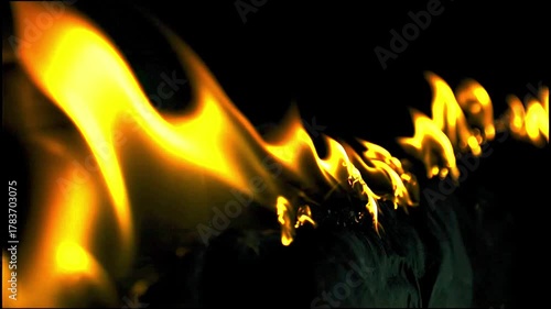 Intense Yellow Flames Licking Upwards From A Source In A High Contrast Composition Style Image