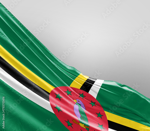 Dominica flag waving on grey background. Dominica national flag for independence day.