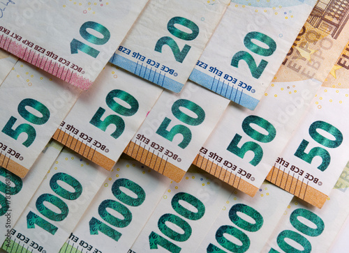 Close up of euros banknote and coins.