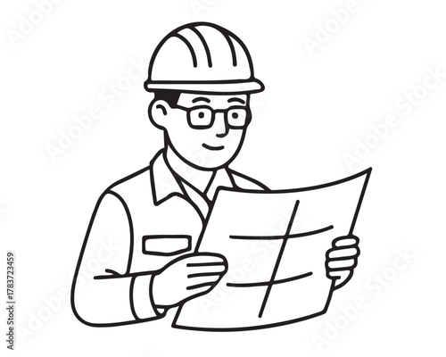 Smiling architect in hard hat reviews blueprints, planning construction or renovation projects with focus and expertise.