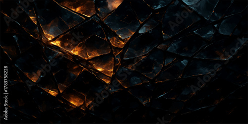 Close-up of bright orange and red flames in a dark fireplace with burning wood for a warm feeling