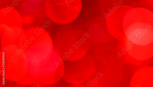 Abstract red bokeh background with bright, blurred, festive light circles for design elements