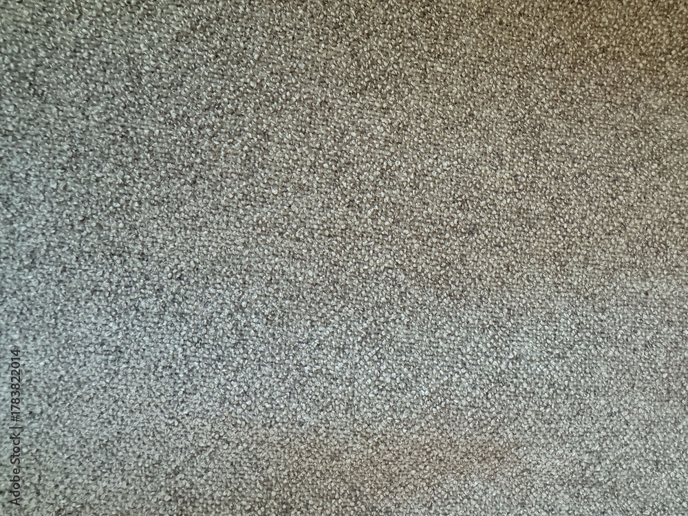 Fototapeta premium Close-up view of textured fabric with subtle gray patterns in a modern setting