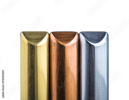 Metallic Columns: A striking visual composition, presenting three sleek, metallic columns in gold, copper, and silver hues, showcasing industrial design