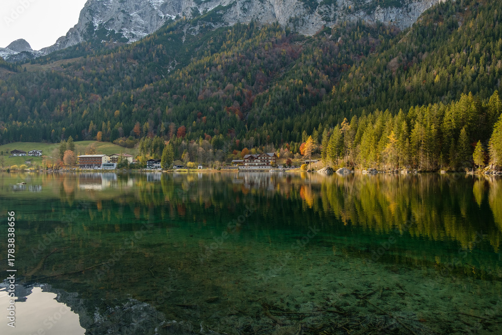 Fototapeta premium Autumn Reflections on a Mountain Lake in the Alps
