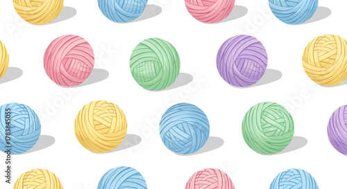 Colorful yarn balls arranged in a repeating pattern on a white surface.