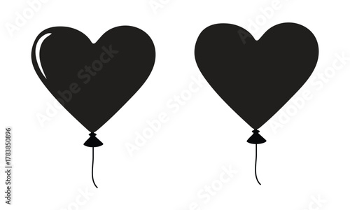 Two black heart balloons floating on transparent background