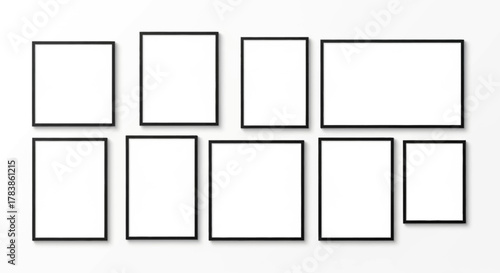Modern empty black picture frames arranged on a white wall, providing a versatile mockup template for displaying art, photos, or graphic designs in a gallery setting