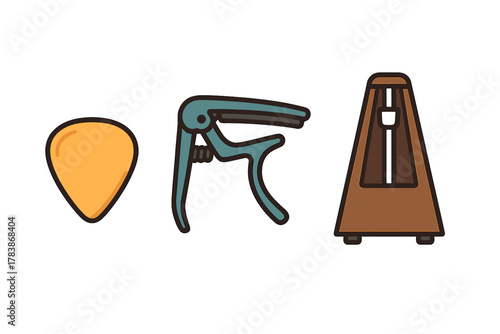 Essential musical accessories including a guitar pick, a capo, and a classic mechanical metronome device