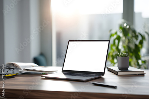 Wallpaper Mural Quiet workspace with a laptop, plants, and books during morning sunlight Torontodigital.ca