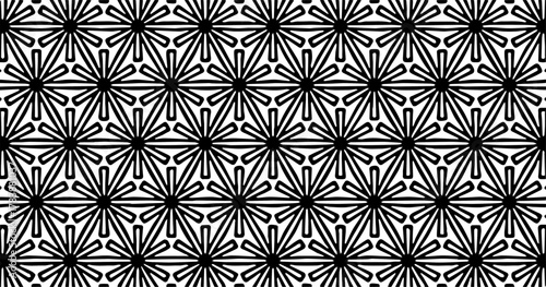Black and white star-like geometric seamless pattern with sharp symmetrical repeating shapes.