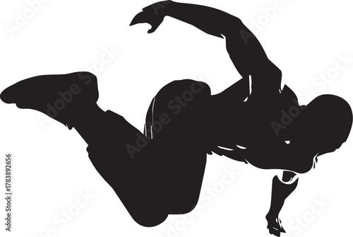 Silhouette of a person executing a dynamic breakdance move in mid-air

