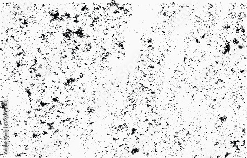 Grunge texture vector featuring a distressed and weathered design on a white background with black speckles and patches ideal for creative projects or backgrounds