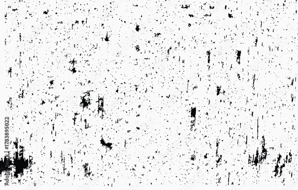 Obraz premium Grunge texture vector featuring uneven black speckles and scratches on a white background, ideal for artistic designs and creative projects