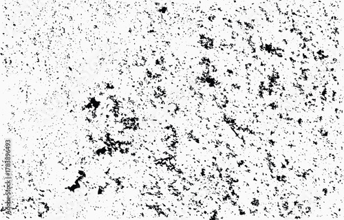 Grunge texture vector featuring black splatters on a white background, suitable for design projects and artistic expressions