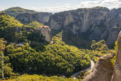 Panoramic View of Meteora Monasteries High on Rock Pillars Above the Lush Green Valley in Kalampaka, Greece
