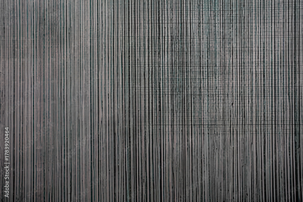 Obraz premium Abstract dark background with vertical painted texture and subtle horizontal weave. Modern monochrome wall covering or canvas