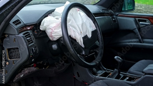 Damaged Car Interior with Deployed Airbag after Road Crash Accident 
