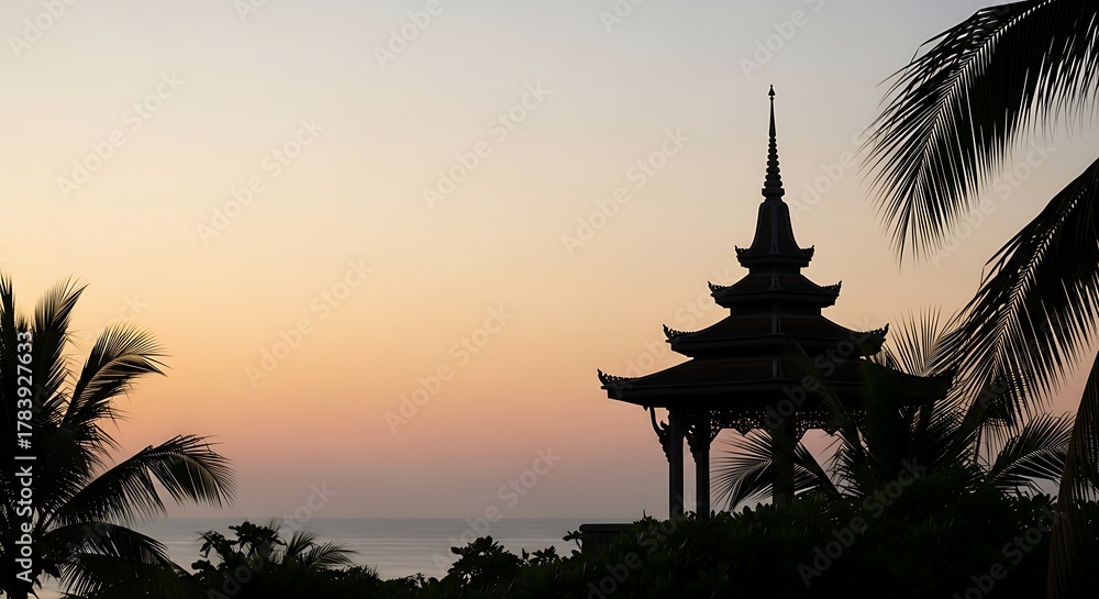 Obraz premium Silhouette of Asian pagoda and palm trees against sunset sky over ocean Asian architecture twilight