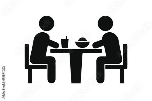 Two monochrome figures are sitting at a table having a meal and drink
