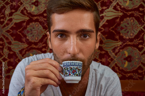 Boy drink coffee in a Istanbul coffee shop