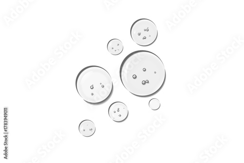 Realistic transparent water or oil droplets or drops on wet clear  surface with crystal clarity circle, rounded water-drop, gel or serum. Fresh clear liquid drop texture, honey bubbles, moisture