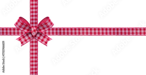 Red and white checked Christmas gift bow and ribbon. Wrapped box layout isolated on a white background.