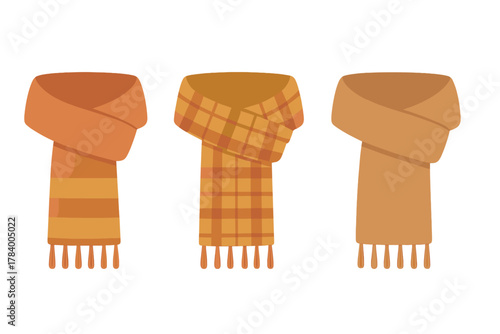 Three knitted scarves in orange and brown autumn winter tones