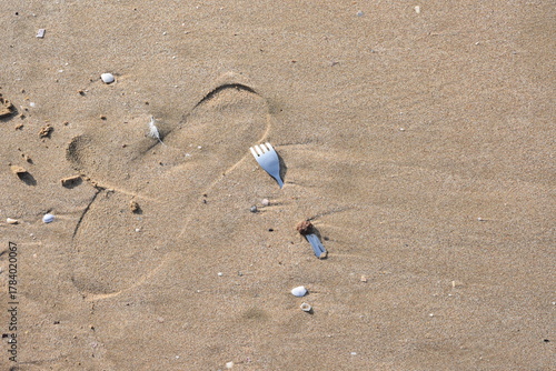 Fork buried in sand