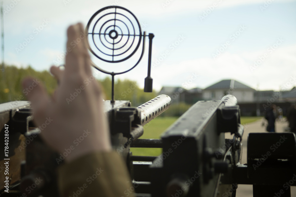 Fototapeta premium Sight of artillery weapon. Machine gun with a scope. Military training.