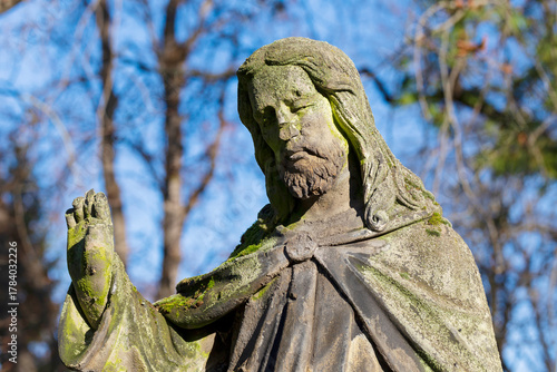 Historic Statue on the autumn mystery old Prague Cemetery, Czech Republic