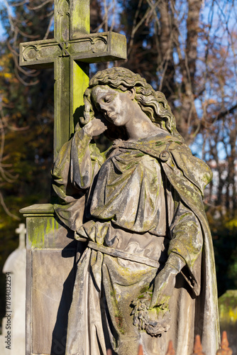 Historic Statue on the autumn mystery old Prague Cemetery, Czech Republic