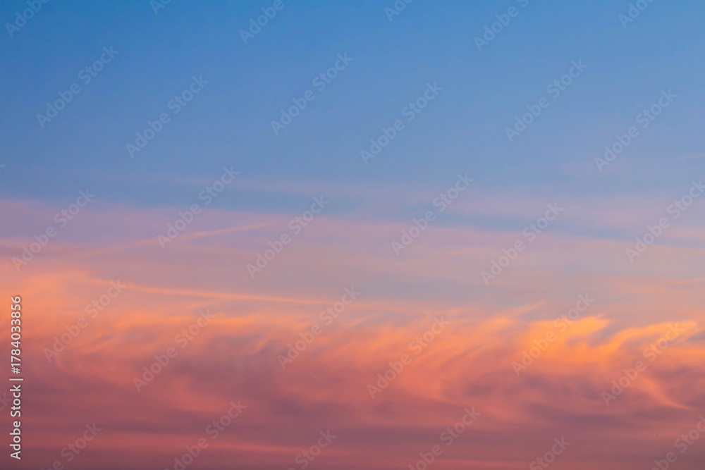 Fototapeta premium Pastel sky at sunset with soft clouds