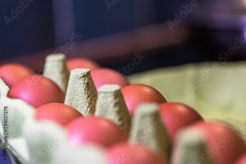 Close-up of Brown Eggs in a Recycled Cardboard Carton with Soft Focus and Natural Light