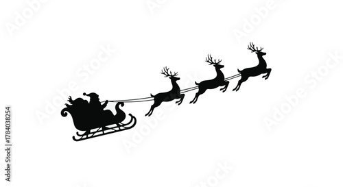 Magical silhouette of Santa Claus flying in his sleigh pulled by reindeer across the night sky.