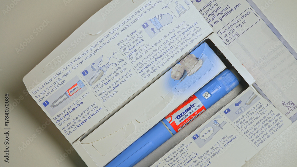Fototapeta premium Ozempic Injection box package and pen closeup display with instructions. Ozempic drug medication for Diabetes treatment. Unprescribed abuse for weight loss: Toronto, Ontario, Canada - October 28, 2025
