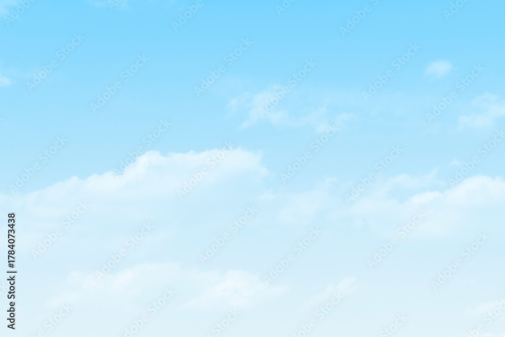 Fototapeta premium Blue pastel sky with white fluffy cloud. Cumulus clouds background. Cloudscape morning sky. The concepts of freedom of life, never give up and positive though energy.