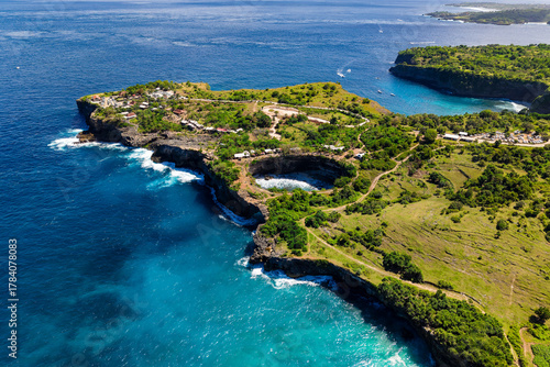 Scenic coastal landscape showing the natural rock arch of Broken Beach in Indonesia.