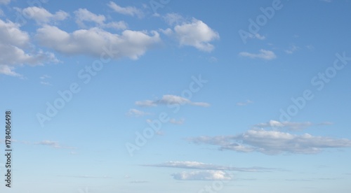 gradient sunny blue sky with clouds background