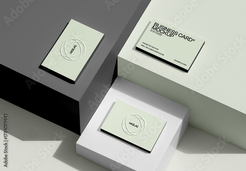 Three Lying on Boxes Business Card Mockups