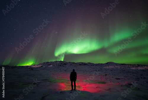 Aurora borealis, northern lights, over Ilulissat icefjord on a cold night of winter