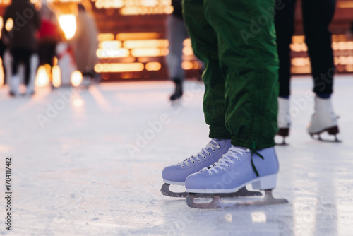 Obraz na płótnie Ice skating on the ice rink arena with people, skating rink surface, ice skating