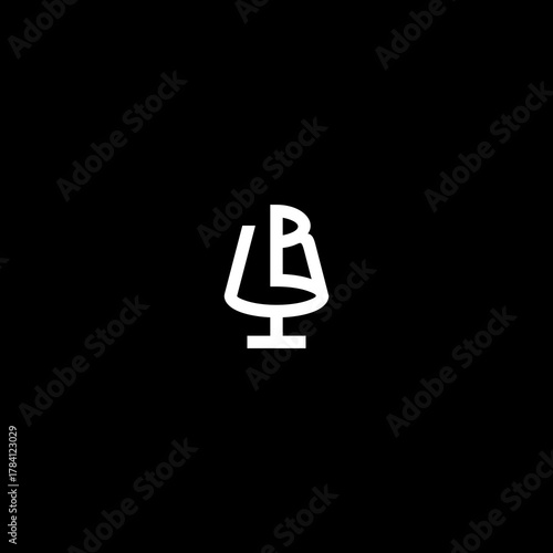 A brandy snifter with a stylized letter B illustration on a dark background, viewed from the front