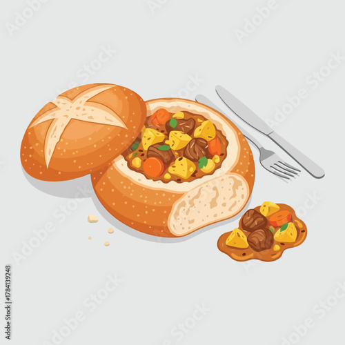 Delicious bread bowl filled with savory stew and vegetables.
