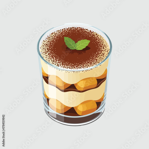 Delicious classic tiramisu dessert served in a transparent glass with mint garnish.